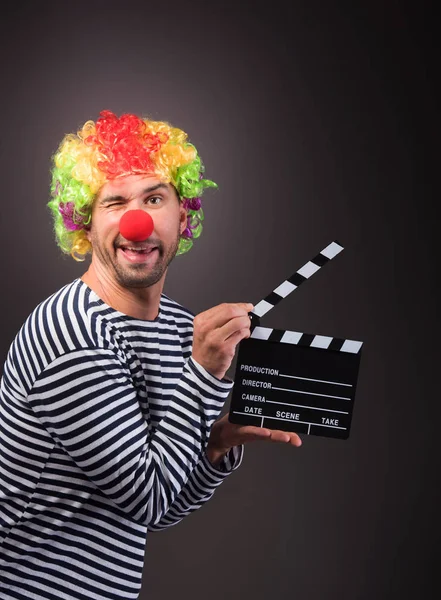 Funny clown with clipper box. — Stock Photo, Image