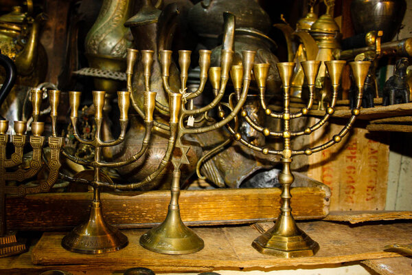 Closeup of religious objects sold in a souvenirs shop in the bazaar of the old city of Jerusalem in Israel 