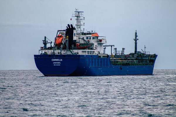 Limassol Cyprus March 20, 2020 View of a ship off the Cypriot coast facing the city of Limassol in the afternoon