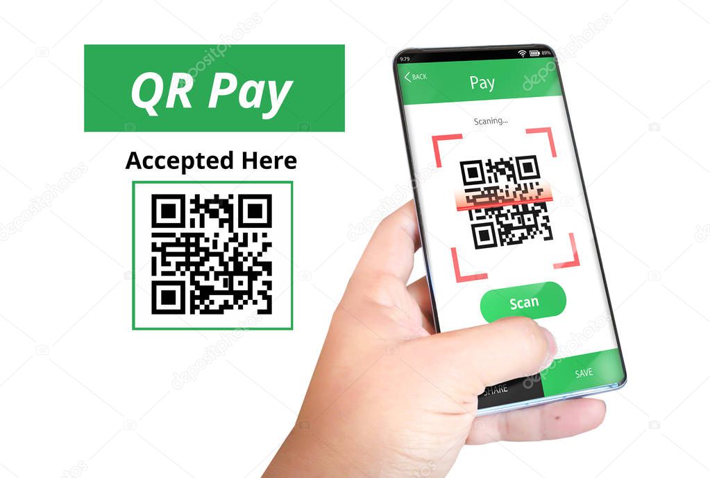 Hand holding smartphone to scan QR code payment , online shopping , cashless technology .