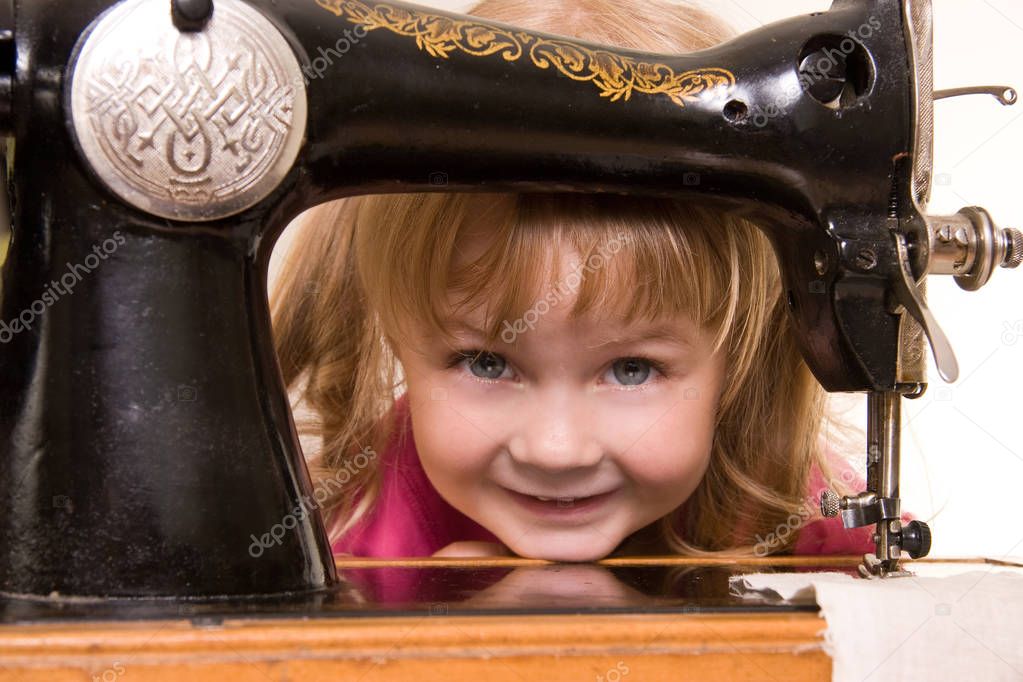 child at old sewing-machine