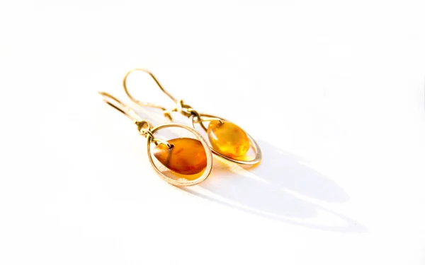 Gold Earrings Amber Light Background — Stock Photo, Image