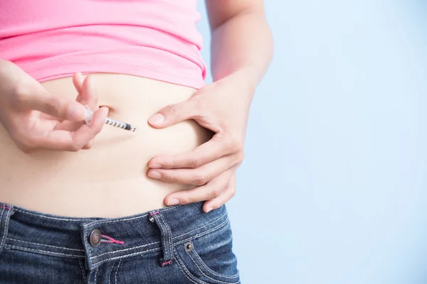 Woman inject to belly — Stock Photo, Image