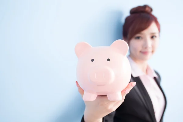 Woman take pink piggy bank — Stock Photo, Image