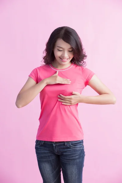 Mujer revisando su pecho . — Foto de Stock