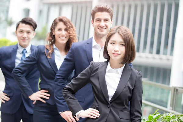 Business people team arms akimbo — Stock Photo, Image