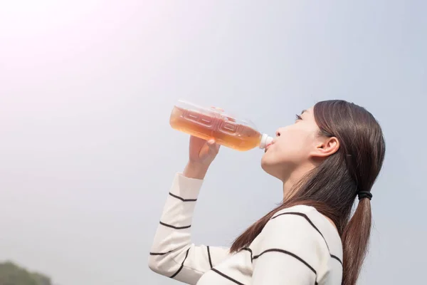 Woman drinking beverage — Stock Photo, Image