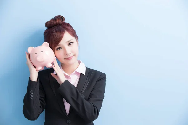 Woman take pink piggy bank — Stock Photo, Image