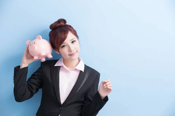 Woman take pink piggy bank — Stock Photo, Image