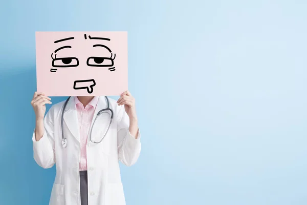 Woman doctor show tired billboard — Stock Photo, Image