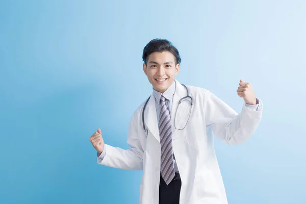 Male doctor showing  strong arms — Stock Photo, Image