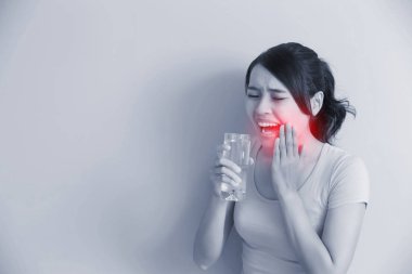woman drinks water with sensitive teeth clipart