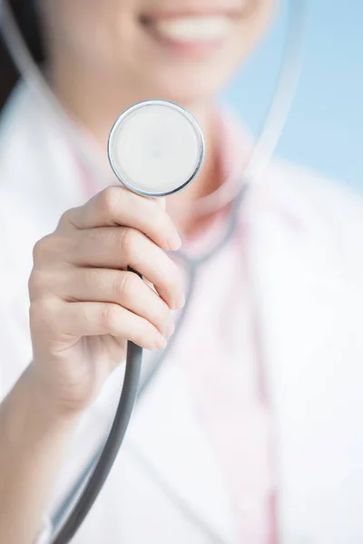 Woman doctor showing  stethoscope — Stock Photo, Image