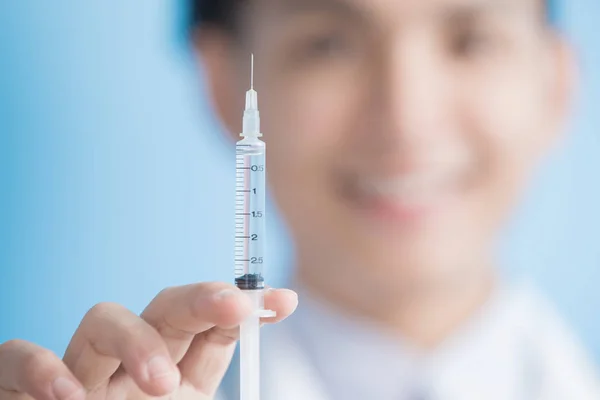 Doctor show syringe to you — Stock Photo, Image