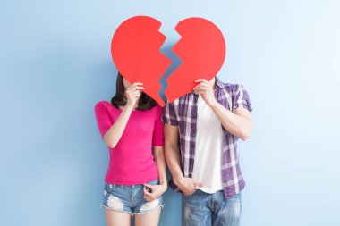 young couple with broken heart  clipart