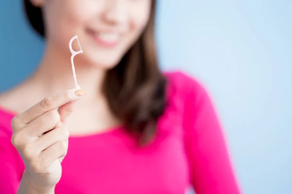 Beautiful  woman with floss — Stock Photo, Image