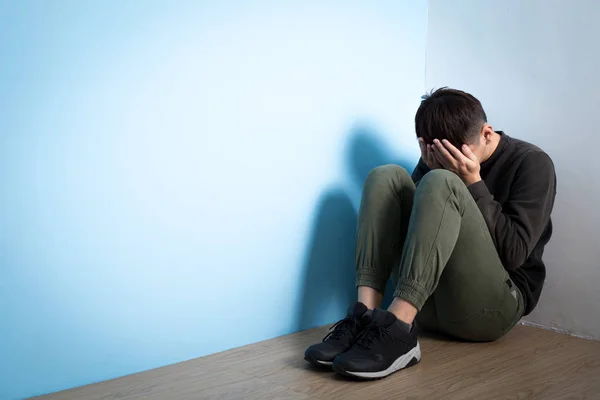 Depressed man sitting on floor — Stock Photo, Image