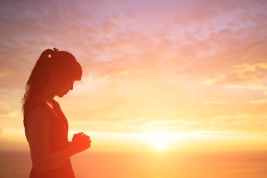 woman praying  pious with sunrise clipart