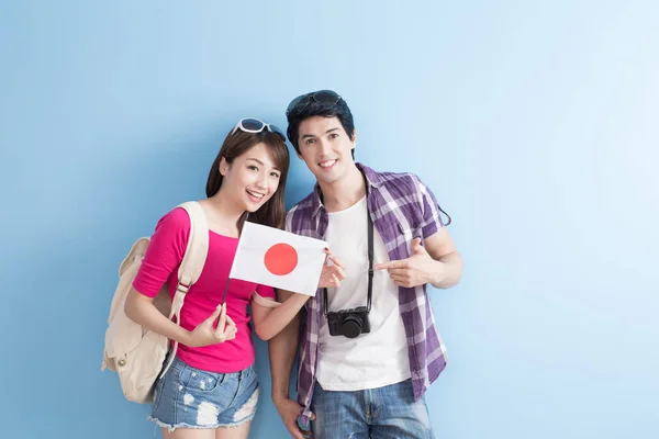 Couple take japan flag — Stock Photo, Image