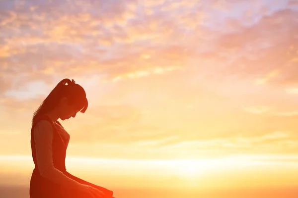 young woman praying