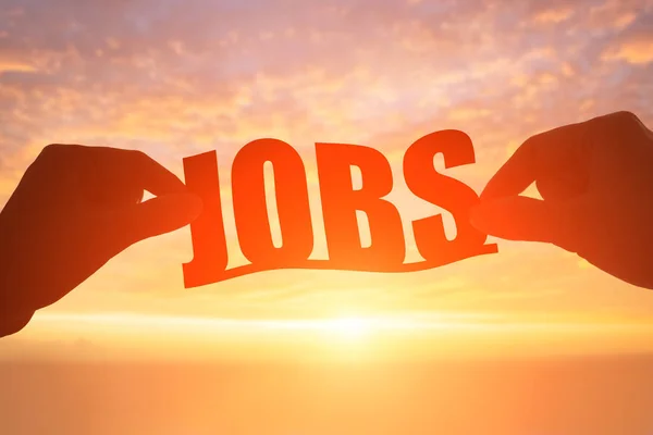 Hands with  jobs word at sunset — Stock Photo, Image