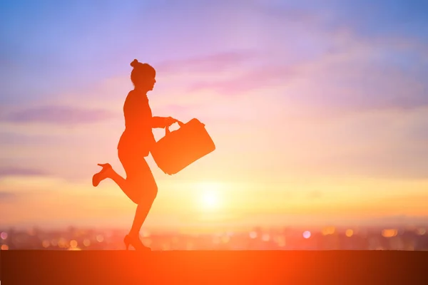 Business woman running at  sunset — Stock Photo, Image