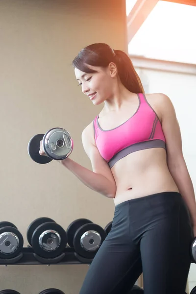 Woman with dumbbell training — Stock Photo, Image