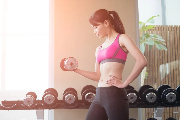 Woman with dumbbell training — Stock Photo, Image