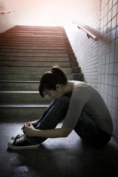 Depressed woman in underground — Stock Photo, Image