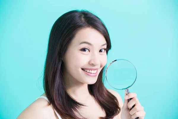 Woman holding  magnifying glass — Stock Photo, Image