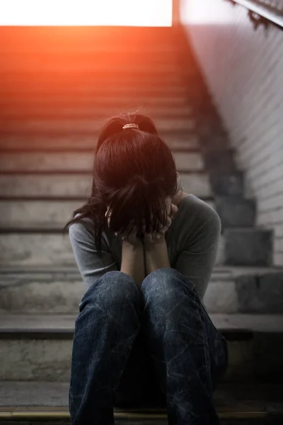 Depressed woman sitting  in underground — Stock Photo, Image