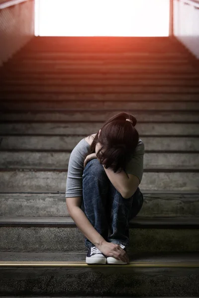 Depressed woman sitting  in underground — Stock Photo, Image