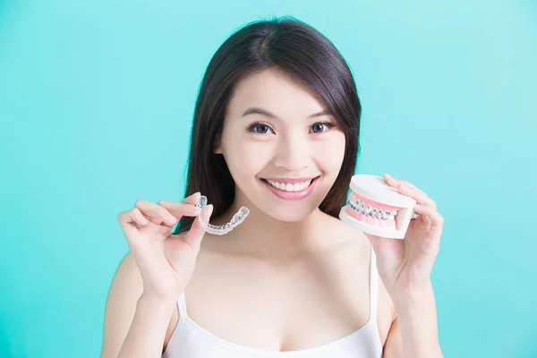 Woman making  choice different braces — Stock Photo, Image