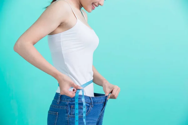 Woman  measuring waistline — Stock Photo, Image