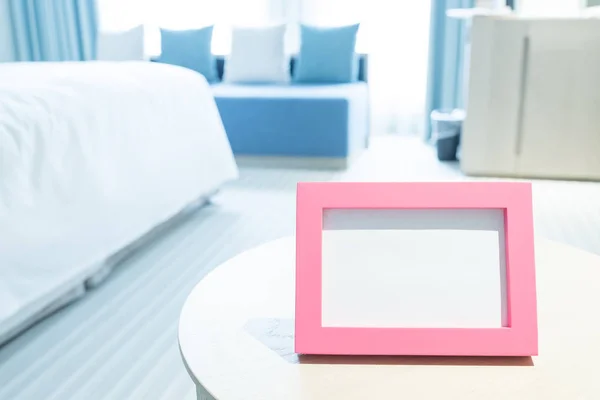 Photo frame on table — Stock Photo, Image