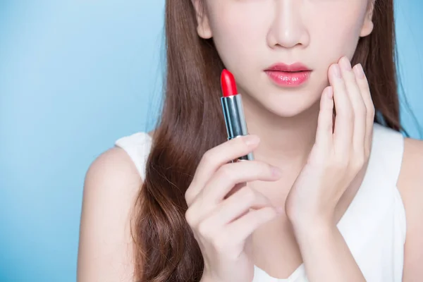 Woman holding  lipstick — Stock Photo, Image