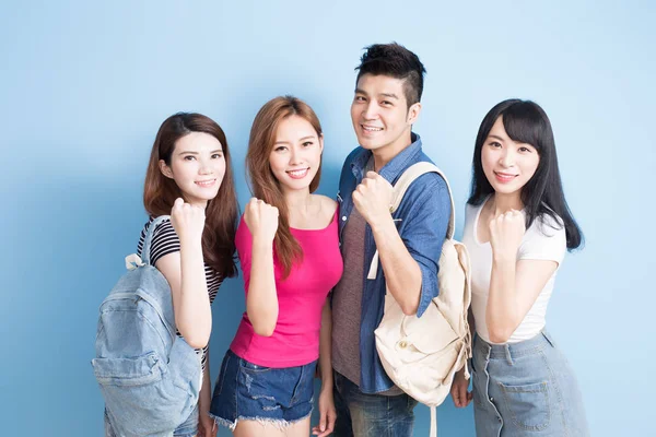 Happy  students  showing  fists — Stock Photo, Image
