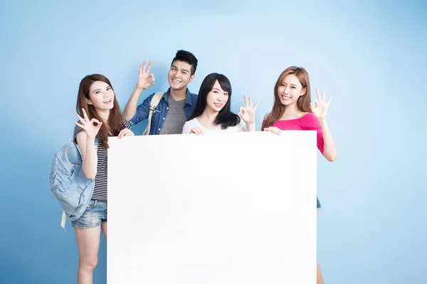 Students with  billboard showing  ok — Stock Photo, Image