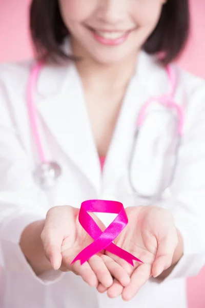 Doctor holding  pink ribbon — Stock Photo, Image