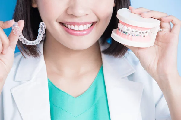 Woman dentist with  brace — Stock Photo, Image
