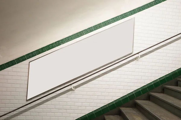 Metro staircase with billboard — Stock Photo, Image