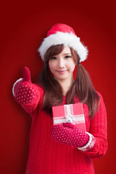 Woman with  gift  showing thumb up — Stock Photo, Image