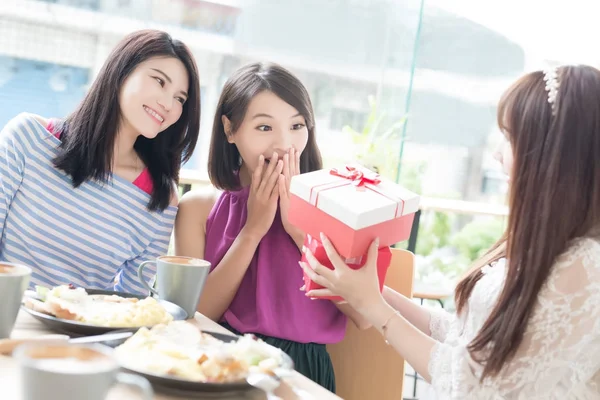 Women friends giving  gift — Stock Photo, Image