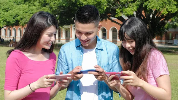 students playing  mobile game