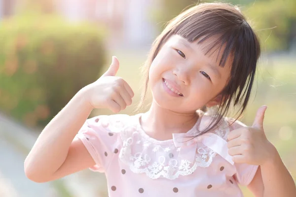 Cute girl  showing  thumbs up Royalty Free Stock Images