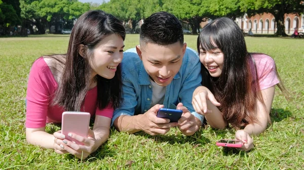 students playing  mobile game