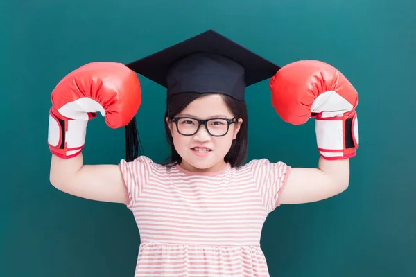 Cute Girl Wearing Bachelor Cap Gloves Blank Green Chalkboard Background — Stock Photo, Image