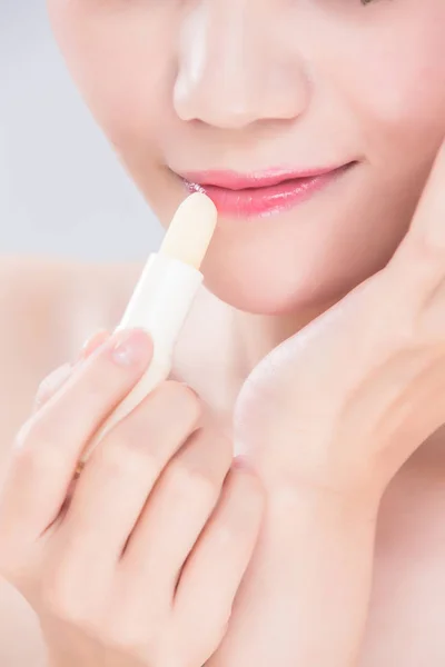 Woman Using Lip Balm Gray Background — Stock Photo, Image