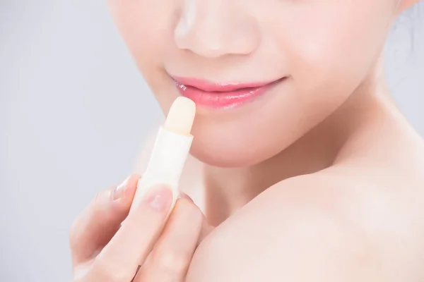 Woman Use Lip Balm Gray Background — Stock Photo, Image