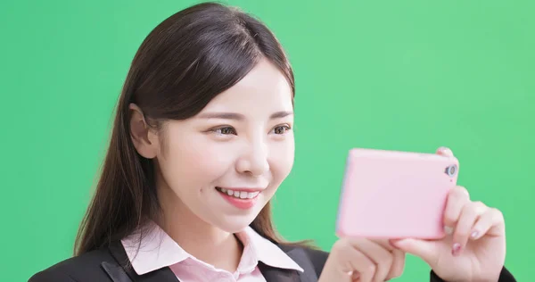 Business Woman Taking Selfie Happily Green Background — стоковое фото